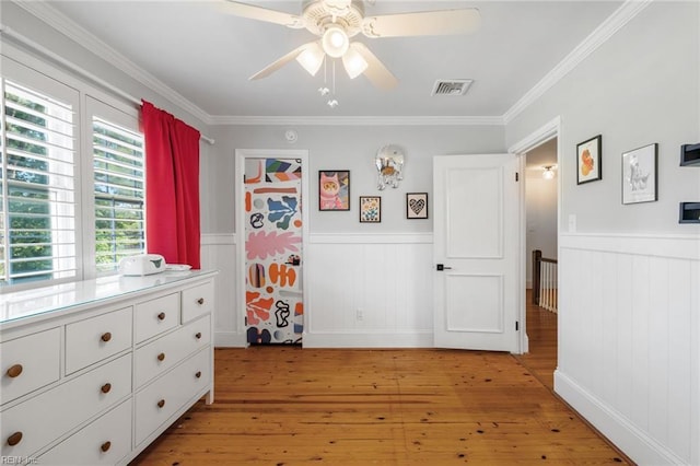6070 Newport Pt, Norfolk, VA 23505 - bedroom featuring a wainscoted wall, light wood-style floors, crown molding, and ceiling fan