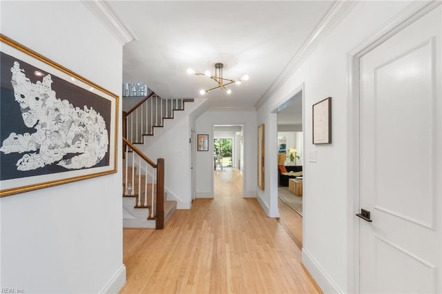 6070 Newport Pt, Norfolk, VA 23505 - entryway featuring light wood finished floors, ornamental molding, stairs, and a chandelier