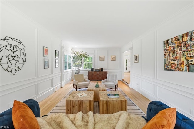 6070 Newport Pt, Norfolk, VA 23505 - living room featuring a decorative wall, light wood-type flooring, and crown molding