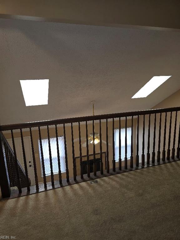 238 Susan Constant Dr, Newport News, VA 23608 - stairway with carpet and a skylight