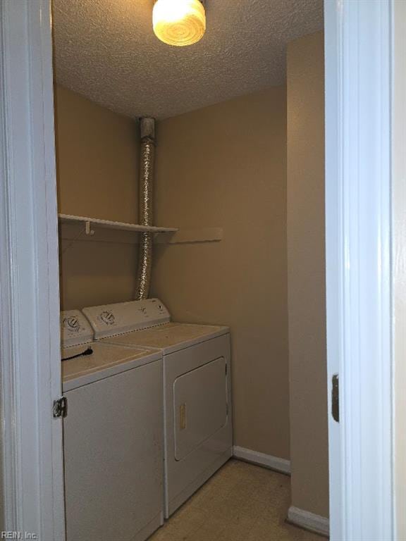 238 Susan Constant Dr, Newport News, VA 23608 - washroom featuring washing machine and dryer, light floors, and a textured ceiling