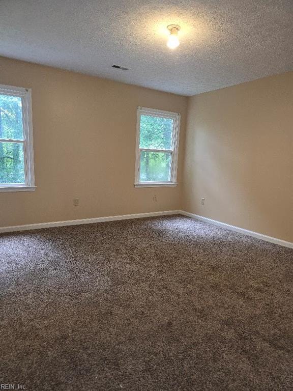 238 Susan Constant Dr, Newport News, VA 23608 - empty room featuring a textured ceiling and carpet floors