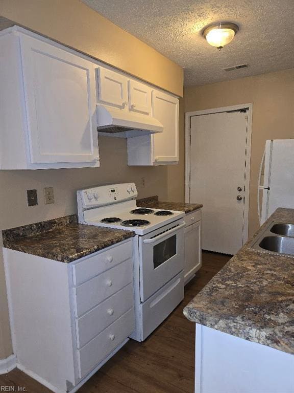 238 Susan Constant Dr, Newport News, VA 23608 - kitchen with white appliances, under cabinet range hood, dark wood-style flooring, white cabinets, and a textured ceiling