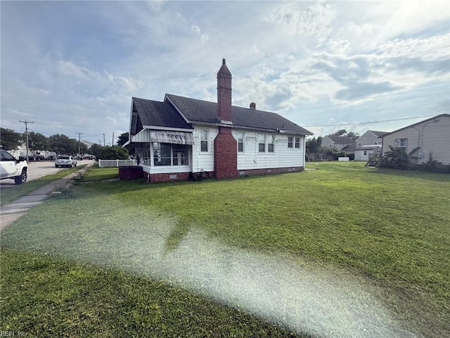 261 N First St, Hampton, VA 23664 - rear view of property featuring crawl space, a yard, a chimney, and a shingled roof