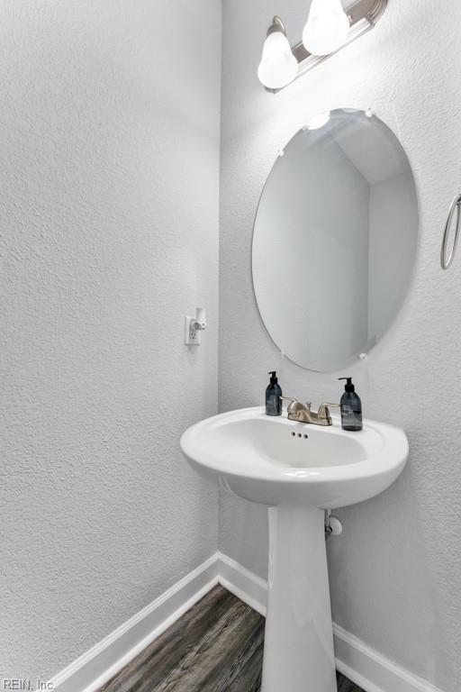 1332 Fishermans Rd, Norfolk, VA 23503 - bathroom with baseboards and wood finished floors