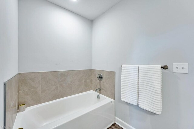 1332 Fishermans Rd, Norfolk, VA 23503 - bathroom with a garden tub and baseboards