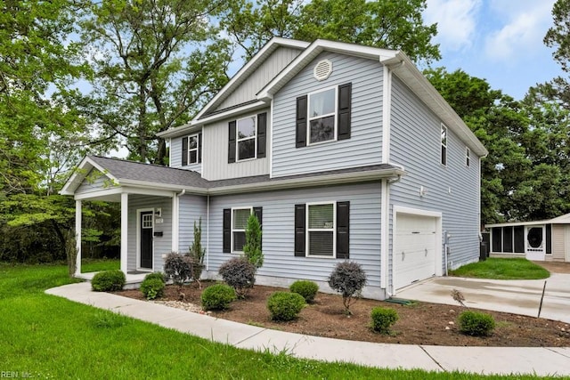 1332 Fishermans Rd, Norfolk, VA 23503 - view of front facade featuring a garage, concrete driveway, a front lawn, and board and batten siding