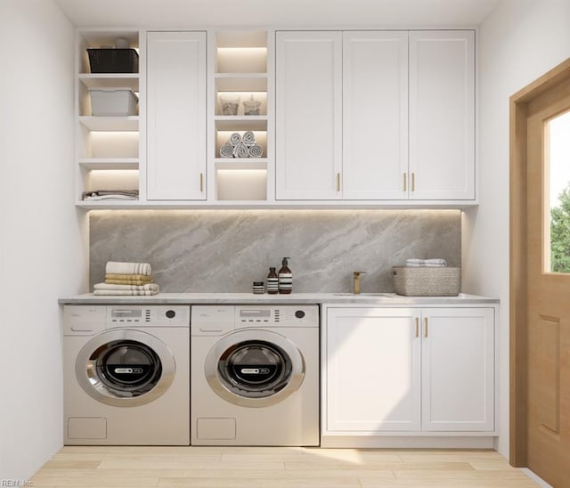 0 Kings Point Ave, Smithfield, VA 23430 - laundry area featuring washer and clothes dryer, cabinet space, and light wood-type flooring