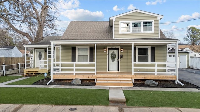 2320 Early St, Norfolk, VA 23513 - view of front facade featuring a porch, a shingled roof, a garage, and driveway
