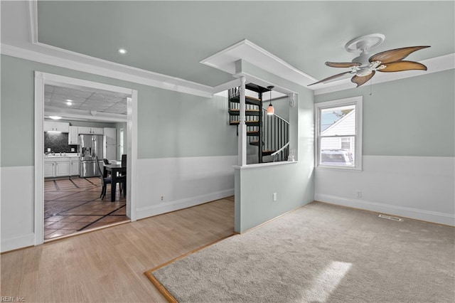 2320 Early St, Norfolk, VA 23513 - spare room with stairway, ornamental molding, ceiling fan, wood finished floors, and recessed lighting