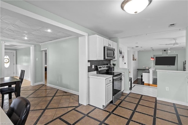 2320 Early St, Norfolk, VA 23513 - kitchen featuring stainless steel appliances, white cabinetry, light countertops, tile patterned floors, and inlaid floor details