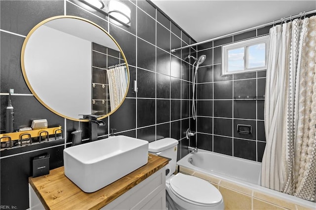 2320 Early St, Norfolk, VA 23513 - bathroom featuring tiled shower / bath, tile walls, and vanity