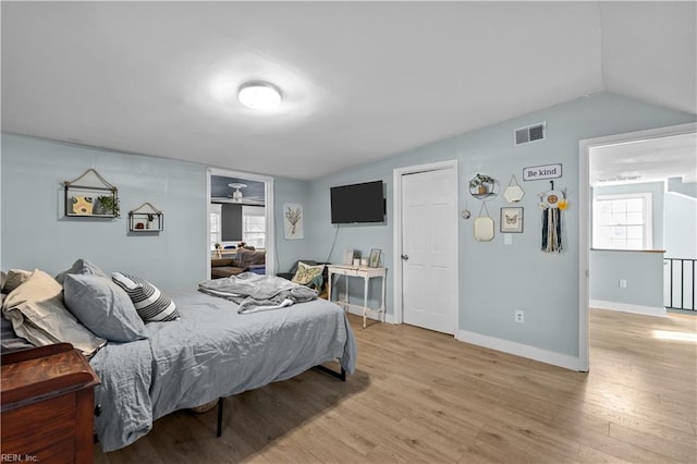 2320 Early St, Norfolk, VA 23513 - bedroom with lofted ceiling and light wood-style floors