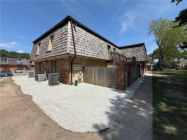 146 Saw Grass Bnd, Virginia Beach, VA 23451 - view of property exterior featuring mansard roof and brick siding