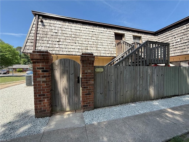 146 Saw Grass Bnd, Virginia Beach, VA 23451 - view of front of property with mansard roof and a gate