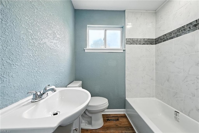 2214 Berkley Ave, Chesapeake, VA 23324 - bathroom featuring wood finished floors, a textured wall, and vanity
