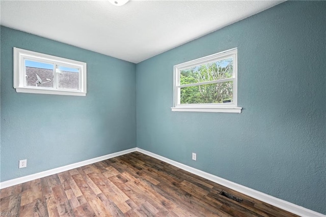 2214 Berkley Ave, Chesapeake, VA 23324 - empty room featuring wood finished floors and a textured wall
