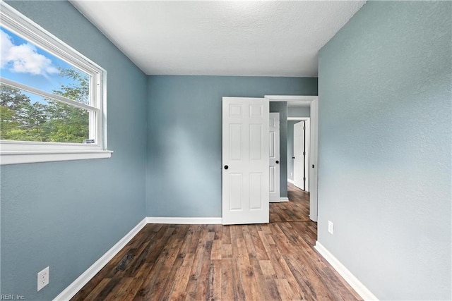 2214 Berkley Ave, Chesapeake, VA 23324 - spare room featuring wood-type flooring and a textured ceiling