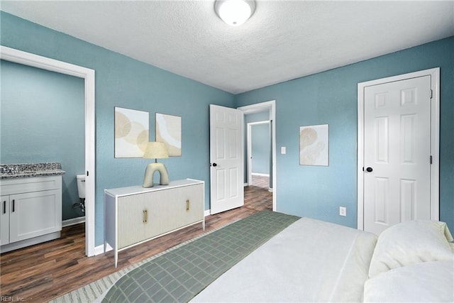 2214 Berkley Ave, Chesapeake, VA 23324 - bedroom with dark wood-style flooring, a textured ceiling, and ensuite bathroom