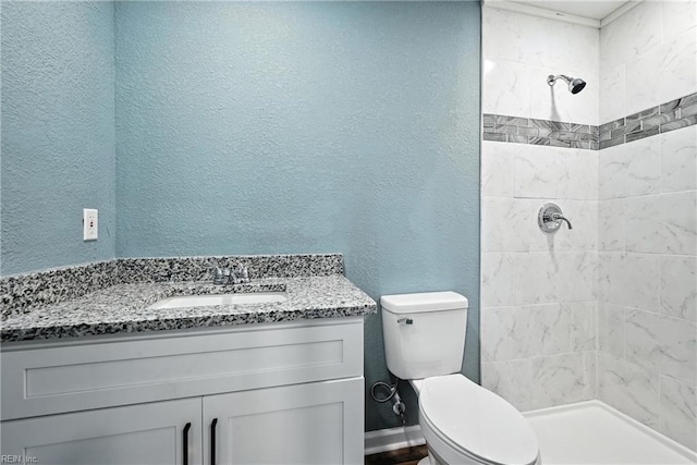2214 Berkley Ave, Chesapeake, VA 23324 - full bathroom featuring tiled shower, a textured wall, and vanity