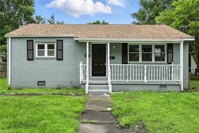 2214 Berkley Ave, Chesapeake, VA 23324 - view of front of house with crawl space, brick siding, a porch, and roof with shingles