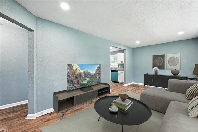 2214 Berkley Ave, Chesapeake, VA 23324 - living room featuring wood finished floors, a textured ceiling, recessed lighting, and a textured wall