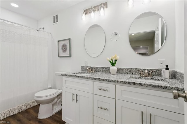 433 Queens Creek Rd, Williamsburg, VA 23185 - bathroom featuring double vanity, wood finished floors, and shower / bathtub combination with curtain