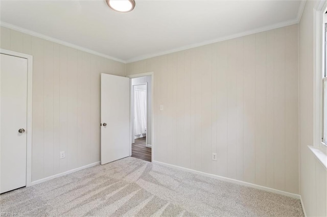 433 Queens Creek Rd, Williamsburg, VA 23185 - unfurnished bedroom featuring carpet, ornamental molding, and wooden walls