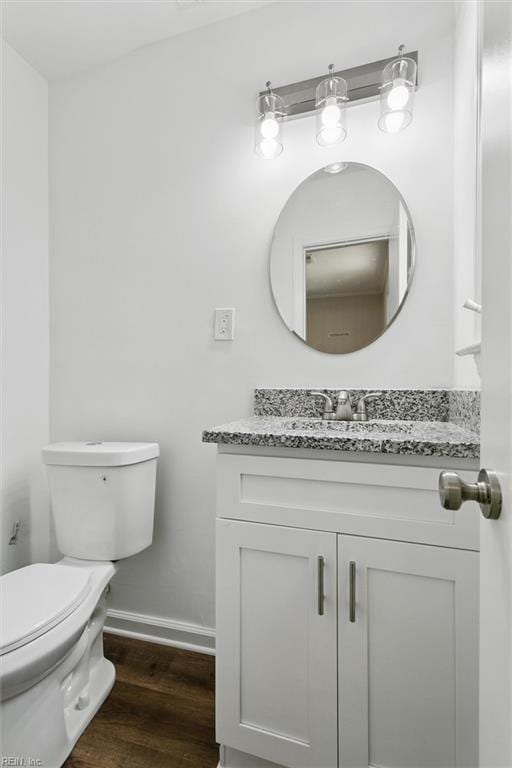 433 Queens Creek Rd, Williamsburg, VA 23185 - half bath featuring vanity and wood finished floors
