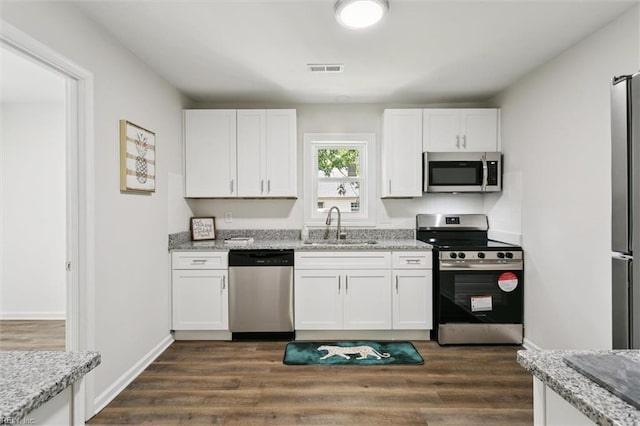 433 Queens Creek Rd, Williamsburg, VA 23185 - kitchen featuring appliances with stainless steel finishes, white cabinets, and dark wood finished floors