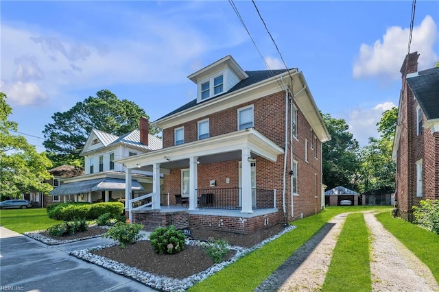 118 Saint James Ave, Suffolk, VA 23434 - traditional style home featuring brick siding, a porch, and driveway