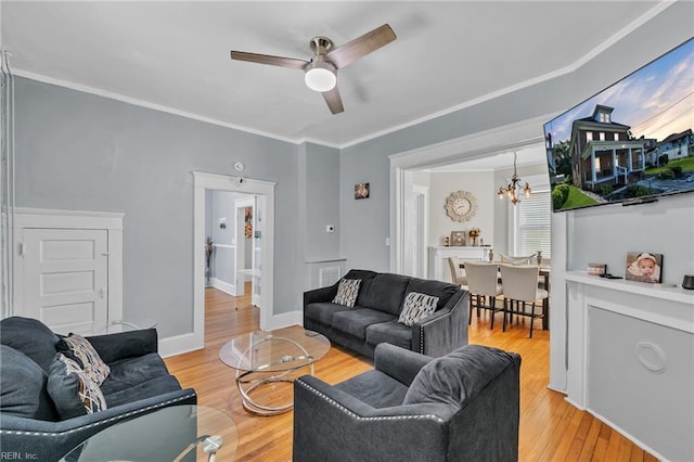 118 Saint James Ave, Suffolk, VA 23434 - living area with ceiling fan, light wood finished floors, ornamental molding, and a chandelier