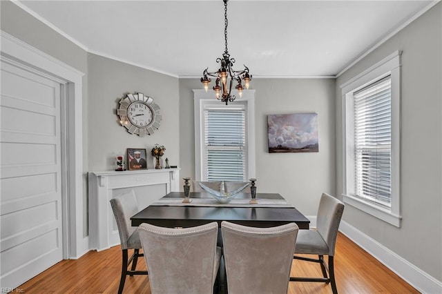 118 Saint James Ave, Suffolk, VA 23434 - dining area with a chandelier, light wood finished floors, and ornamental molding