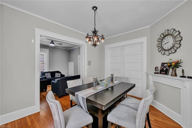 118 Saint James Ave, Suffolk, VA 23434 - dining area with a chandelier, light wood finished floors, and ornamental molding