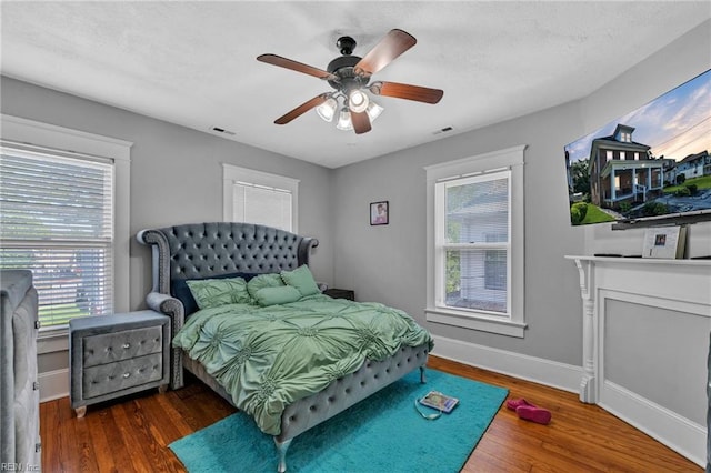 118 Saint James Ave, Suffolk, VA 23434 - bedroom with multiple windows, wood finished floors, and ceiling fan