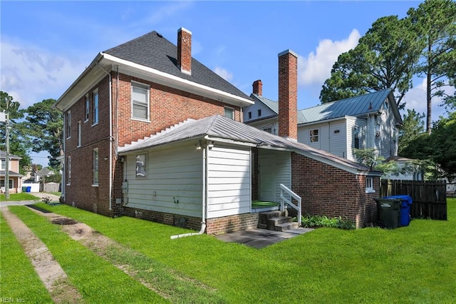 118 Saint James Ave, Suffolk, VA 23434 - rear view of property with a chimney and brick siding