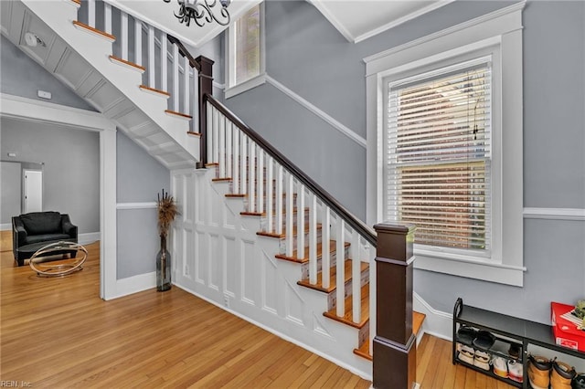 118 Saint James Ave, Suffolk, VA 23434 - stairs with wood finished floors, healthy amount of natural light, and a chandelier