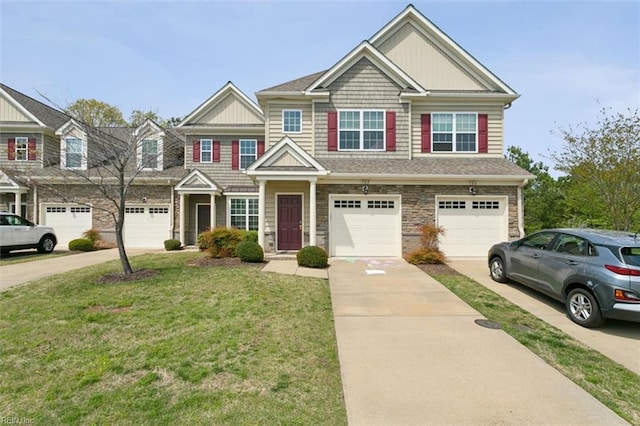 705 Braemar Crk, Williamsburg, VA 23188 - view of front facade featuring driveway, an attached garage, a front yard, and stone siding