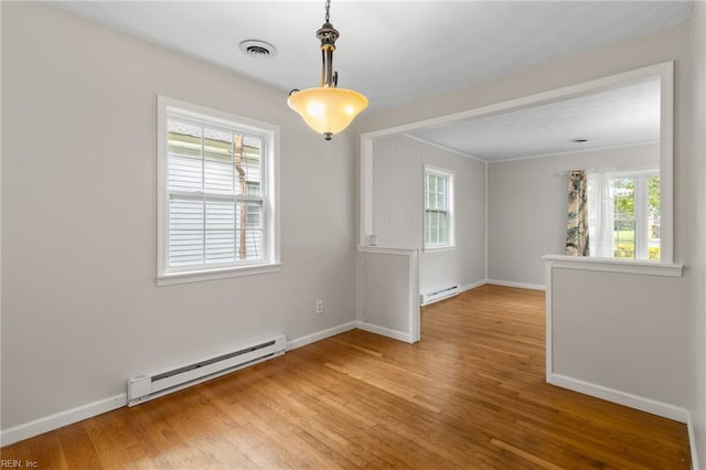 127 Robinson Dr, Newport News, VA 23601 - unfurnished room featuring a baseboard heating unit and light wood-style flooring