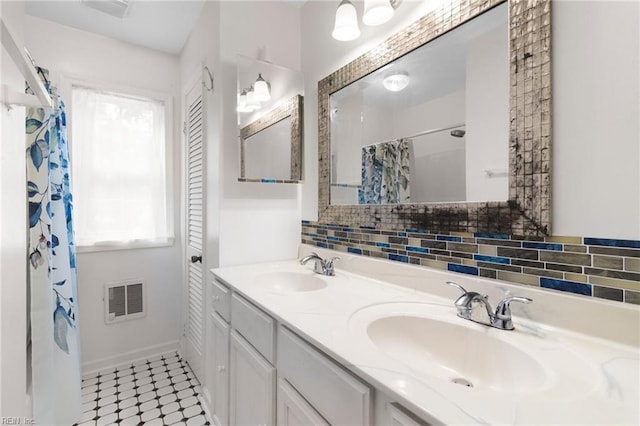 127 Robinson Dr, Newport News, VA 23601 - bathroom featuring double vanity, heating unit, decorative backsplash, and curtained shower