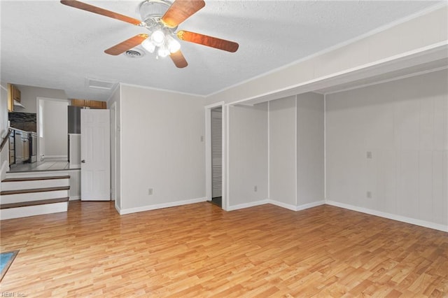 127 Robinson Dr, Newport News, VA 23601 - unfurnished living room with light wood-type flooring, a textured ceiling, a ceiling fan, stairs, and crown molding