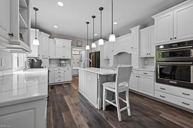 205 Napoli Ct, Chesapeake, VA 23322 - kitchen with appliances with stainless steel finishes, decorative backsplash, white cabinetry, dark wood finished floors, and recessed lighting