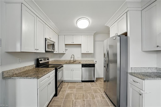 1207 Hazel Ave, Chesapeake, VA 23325 - kitchen featuring stainless steel appliances, white cabinetry, light stone countertops, and stone finish flooring