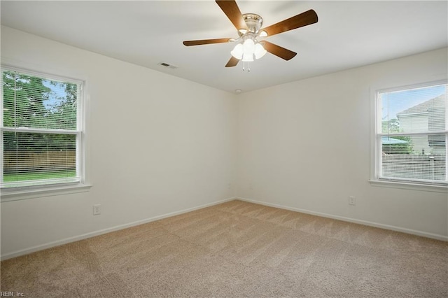 1207 Hazel Ave, Chesapeake, VA 23325 - empty room with plenty of natural light, light carpet, and ceiling fan