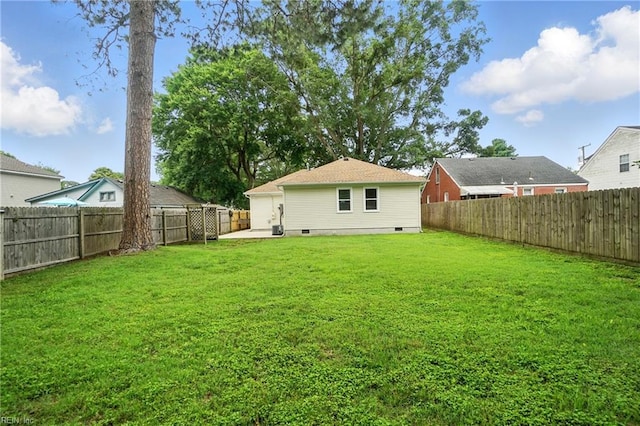 1207 Hazel Ave, Chesapeake, VA 23325 - fenced backyard with a patio