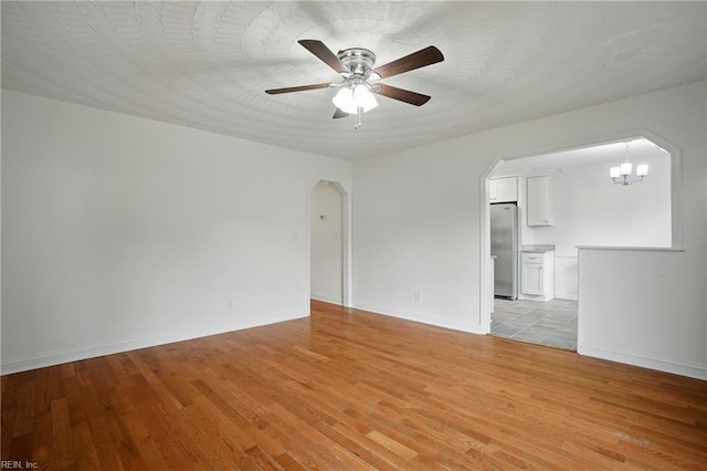 1207 Hazel Ave, Chesapeake, VA 23325 - unfurnished room with arched walkways, ceiling fan, and light wood-style flooring