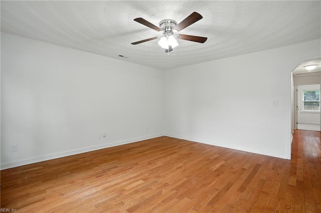 1207 Hazel Ave, Chesapeake, VA 23325 - unfurnished room with a ceiling fan, light wood-type flooring, and arched walkways