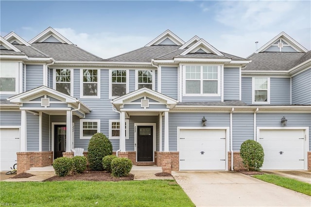 222 Craftsman Cir, Suffolk, VA 23434 - view of property with brick siding, a garage, concrete driveway, and roof with shingles