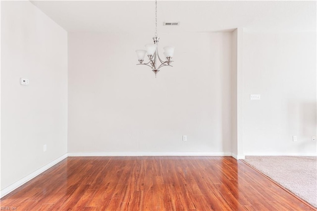 222 Craftsman Cir, Suffolk, VA 23434 - unfurnished room featuring a chandelier and wood finished floors