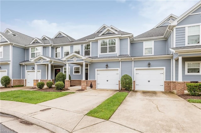 222 Craftsman Cir, Suffolk, VA 23434 - townhome / multi-family property with brick siding, concrete driveway, and an attached garage